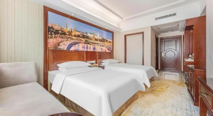 Bed in Vienna International Hotel Guangzhou Tianhe Olympic Stadium Dongpu