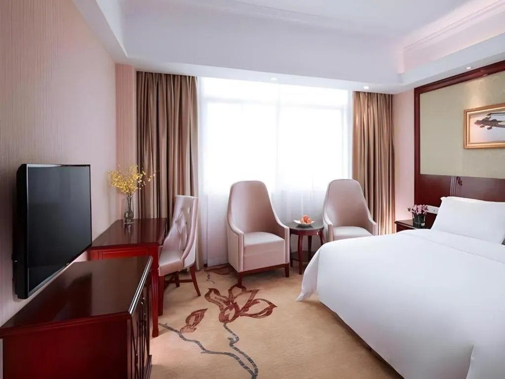 Bed in Vienna International Hotel Guangzhou Tianhe Olympic Stadium Dongpu