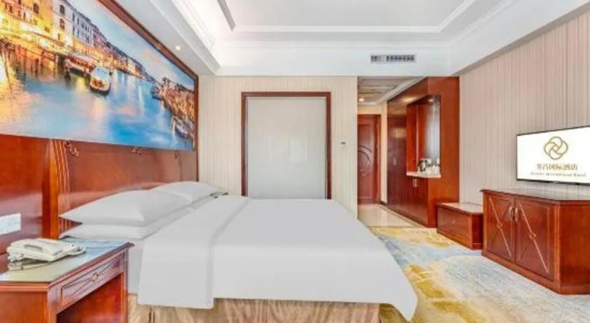 Bed in Vienna International Hotel Guangzhou Tianhe Olympic Stadium Dongpu