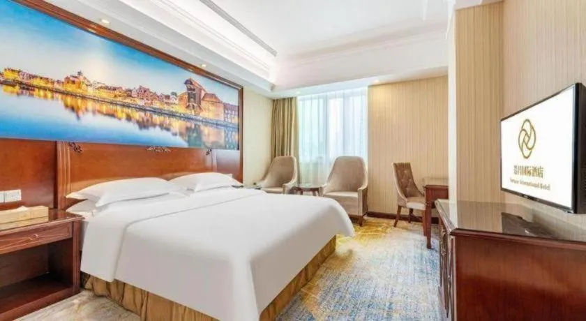 Bed in Vienna International Hotel Guangzhou Tianhe Olympic Stadium Dongpu