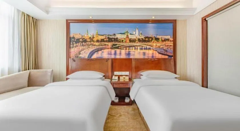 Bed in Vienna International Hotel Guangzhou Tianhe Olympic Stadium Dongpu