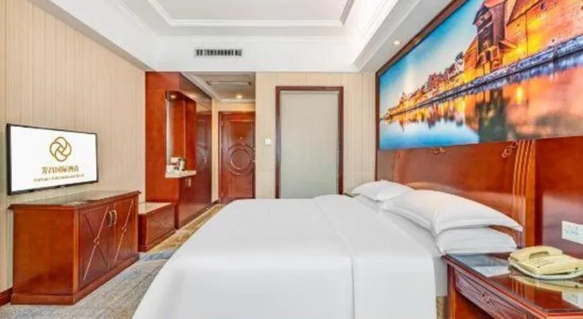 Bed in Vienna International Hotel Guangzhou Tianhe Olympic Stadium Dongpu
