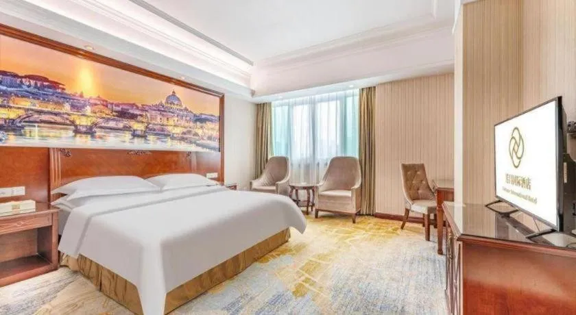 Bed in Vienna International Hotel Guangzhou Tianhe Olympic Stadium Dongpu