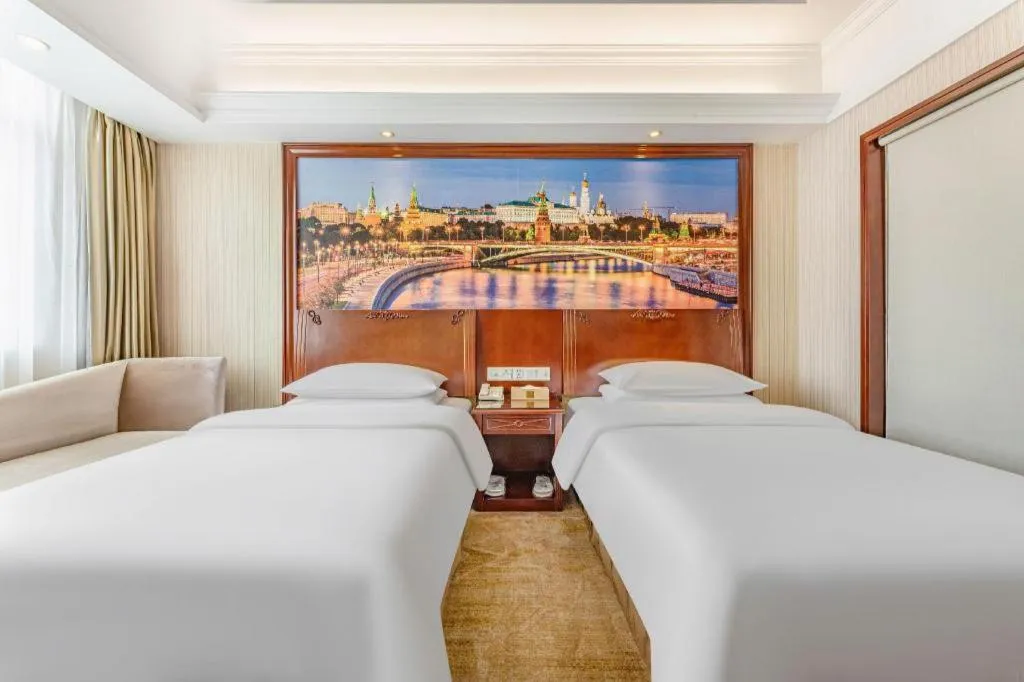 Bed in Vienna International Hotel Guangzhou Tianhe Olympic Stadium Dongpu