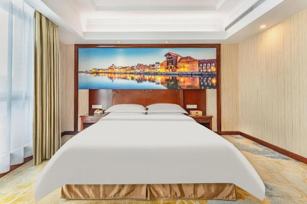 Bed in Vienna International Hotel Guangzhou Tianhe Olympic Stadium Dongpu