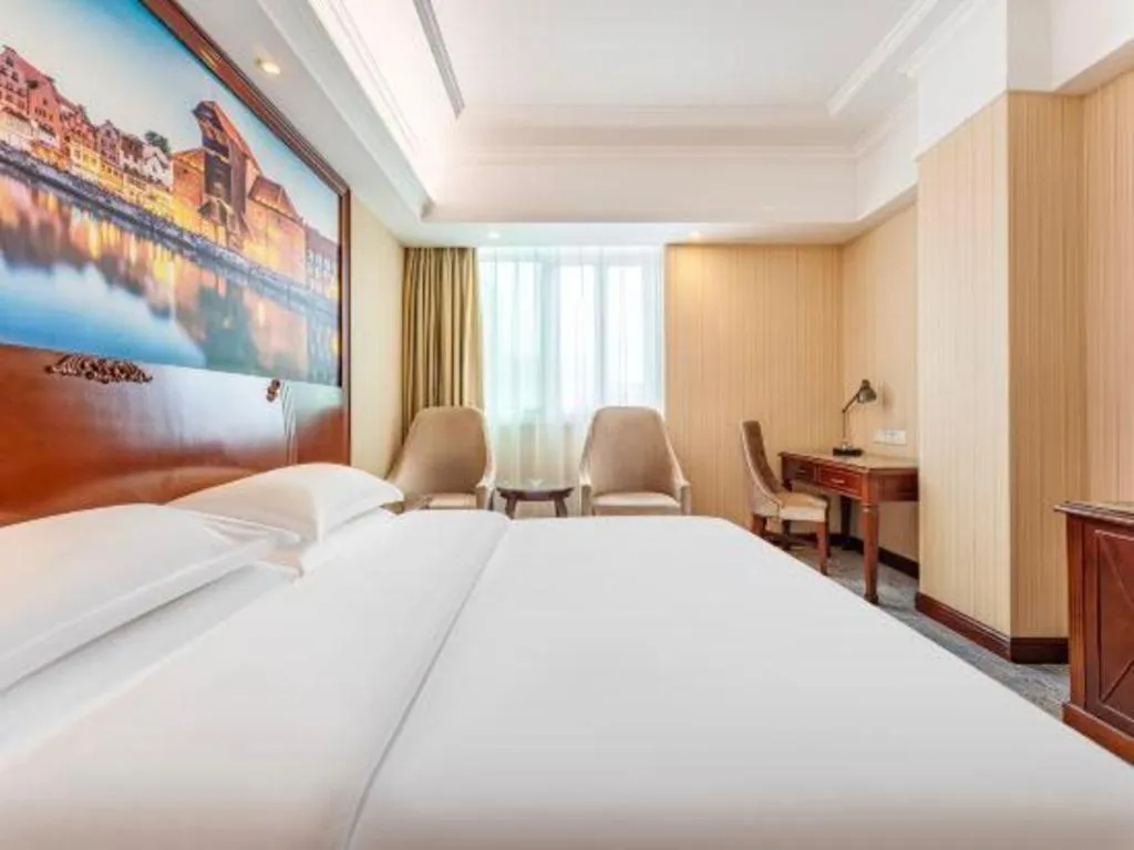 Bed in Vienna International Hotel Guangzhou Tianhe Olympic Stadium Dongpu