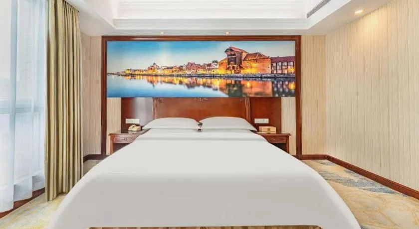 Bed in Vienna International Hotel Guangzhou Tianhe Olympic Stadium Dongpu