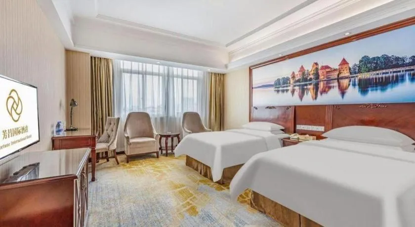 Bed in Vienna International Hotel Guangzhou Tianhe Olympic Stadium Dongpu