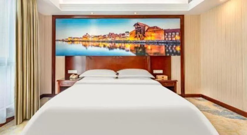 Bed in Vienna International Hotel Guangzhou Tianhe Olympic Stadium Dongpu