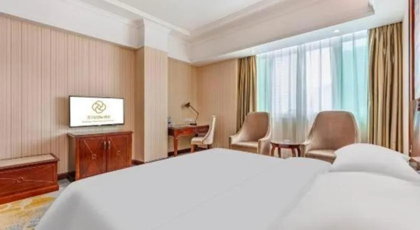 Bed in Vienna International Hotel Guangzhou Tianhe Olympic Stadium Dongpu