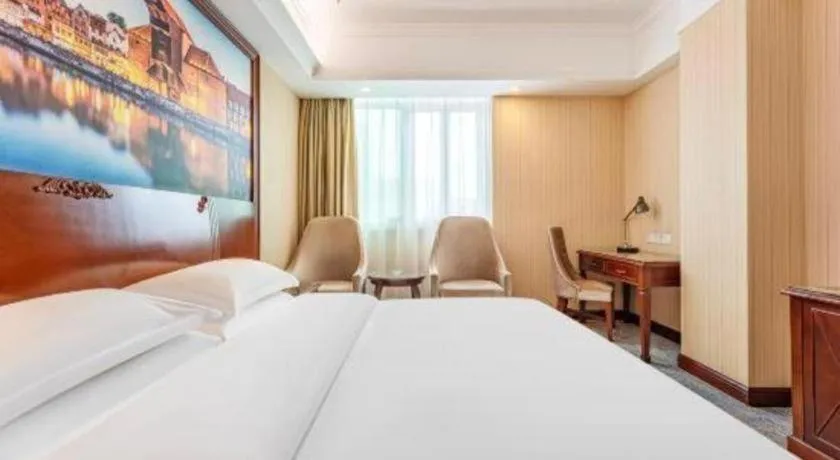 Bed in Vienna International Hotel Guangzhou Tianhe Olympic Stadium Dongpu