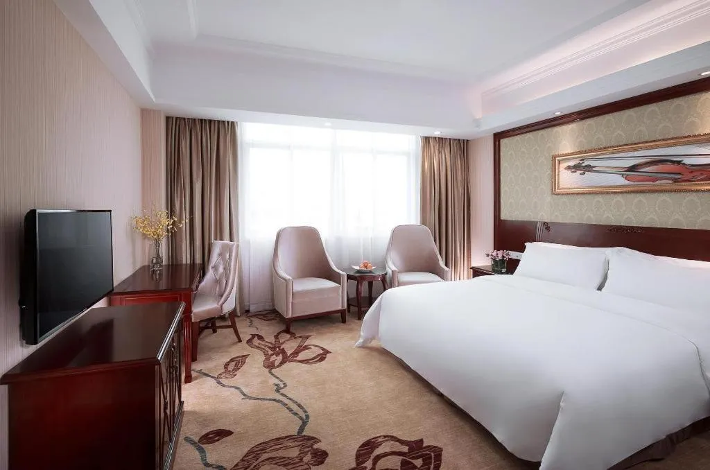 Bed in Vienna International Hotel Guangzhou Tianhe Olympic Stadium Dongpu