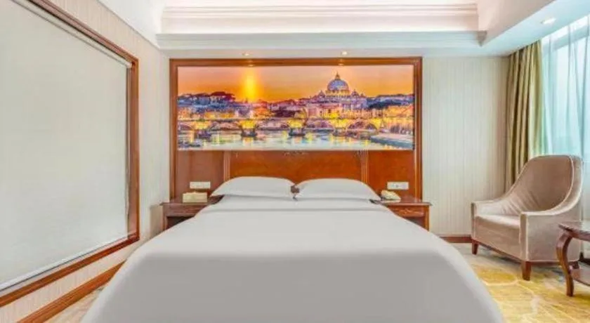 Bed in Vienna International Hotel Guangzhou Tianhe Olympic Stadium Dongpu