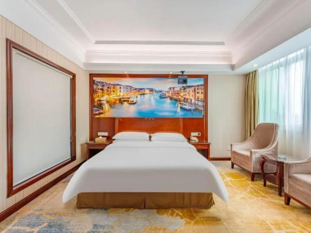 Bed in Vienna International Hotel Guangzhou Tianhe Olympic Stadium Dongpu