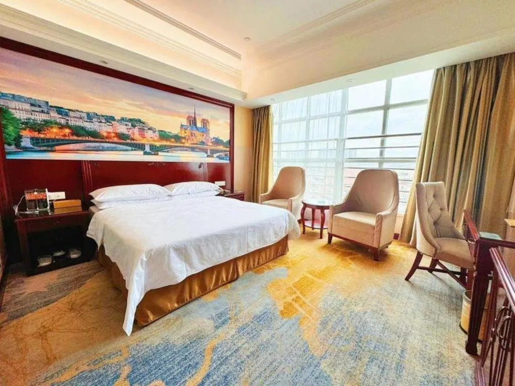 Bed in Vienna International Hotel Guangzhou Tianhe Olympic Stadium Dongpu