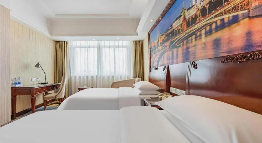 Bed in Vienna International Hotel Guangzhou Tianhe Olympic Stadium Dongpu