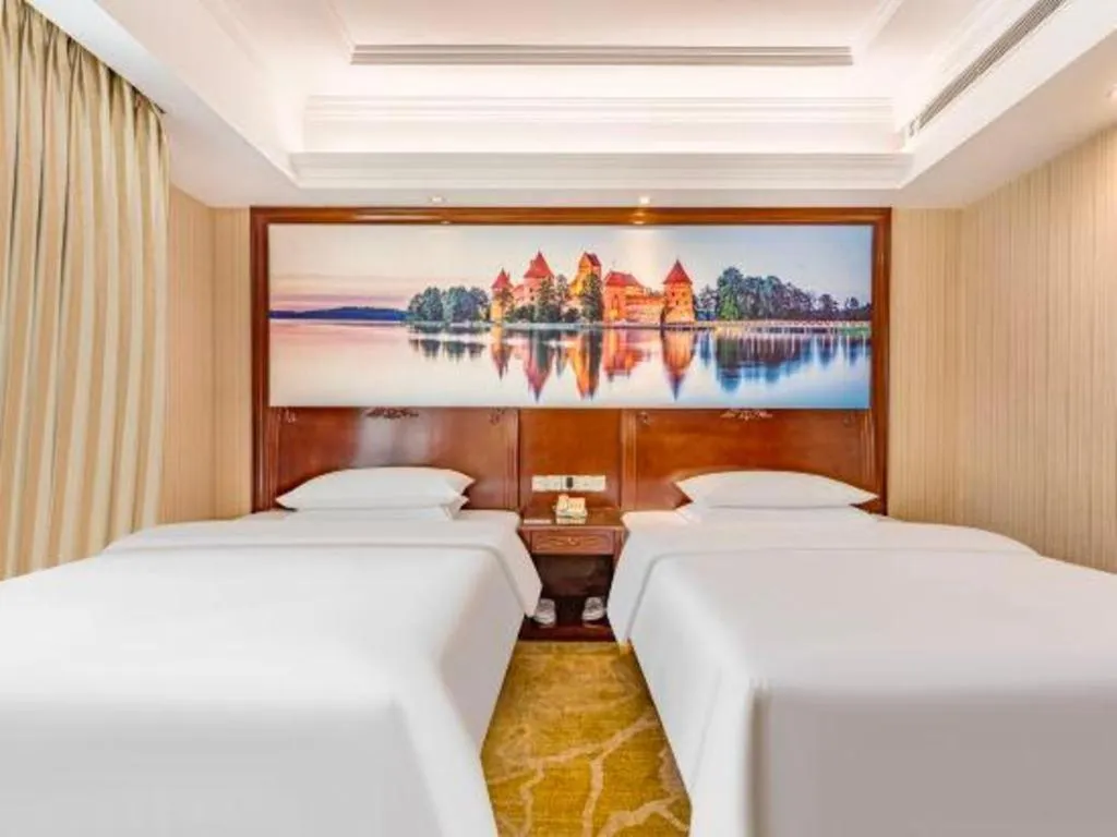 Bed in Vienna International Hotel Guangzhou Tianhe Olympic Stadium Dongpu
