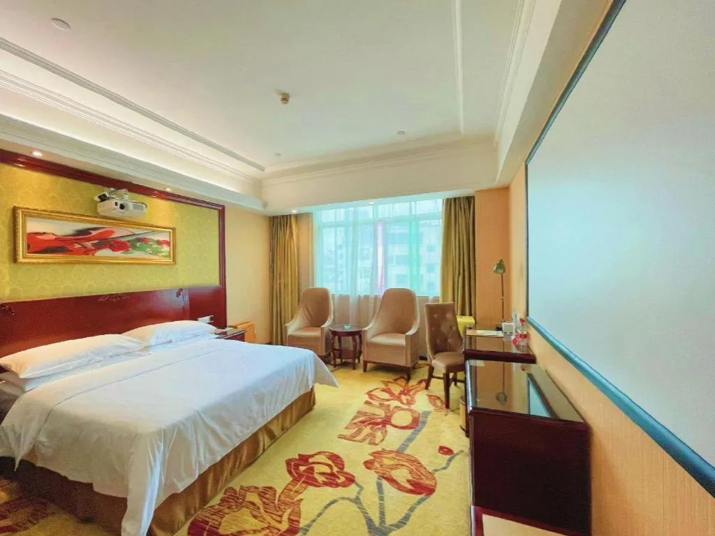 Bed in Vienna International Hotel Guangzhou Tianhe Olympic Stadium Dongpu