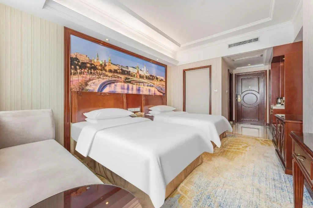 Bed in Vienna International Hotel Guangzhou Tianhe Olympic Stadium Dongpu
