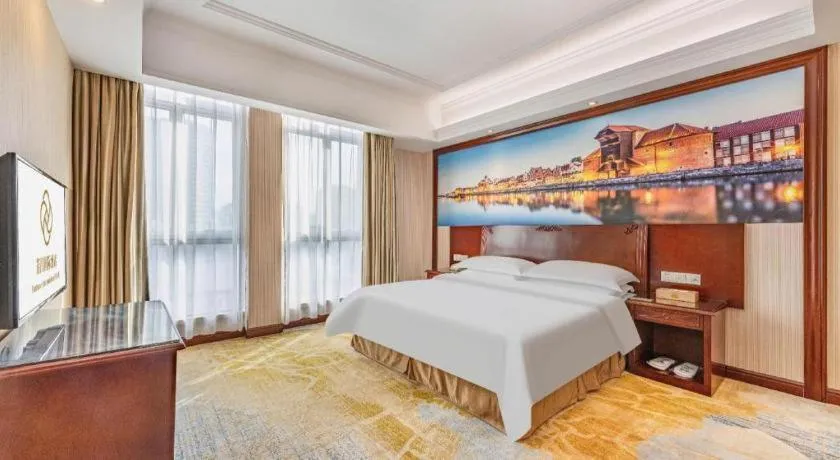 Bed in Vienna International Hotel Guangzhou Tianhe Olympic Stadium Dongpu