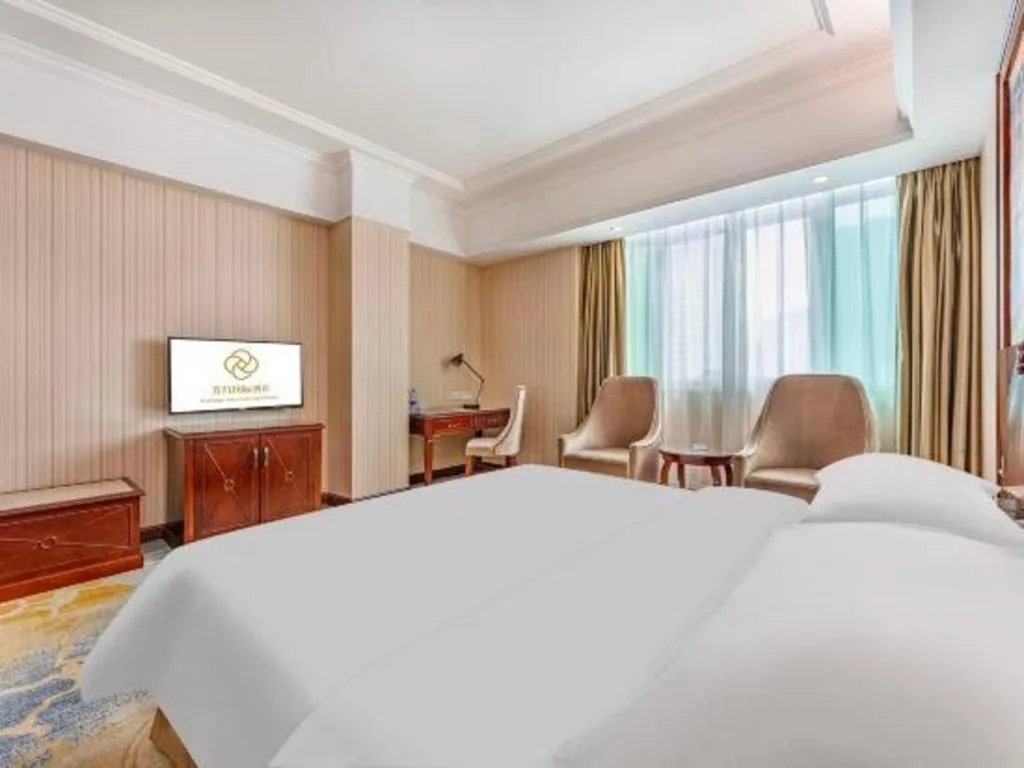 Bed in Vienna International Hotel Guangzhou Tianhe Olympic Stadium Dongpu