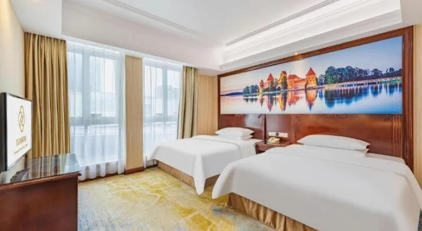 Bed in Vienna International Hotel Guangzhou Tianhe Olympic Stadium Dongpu