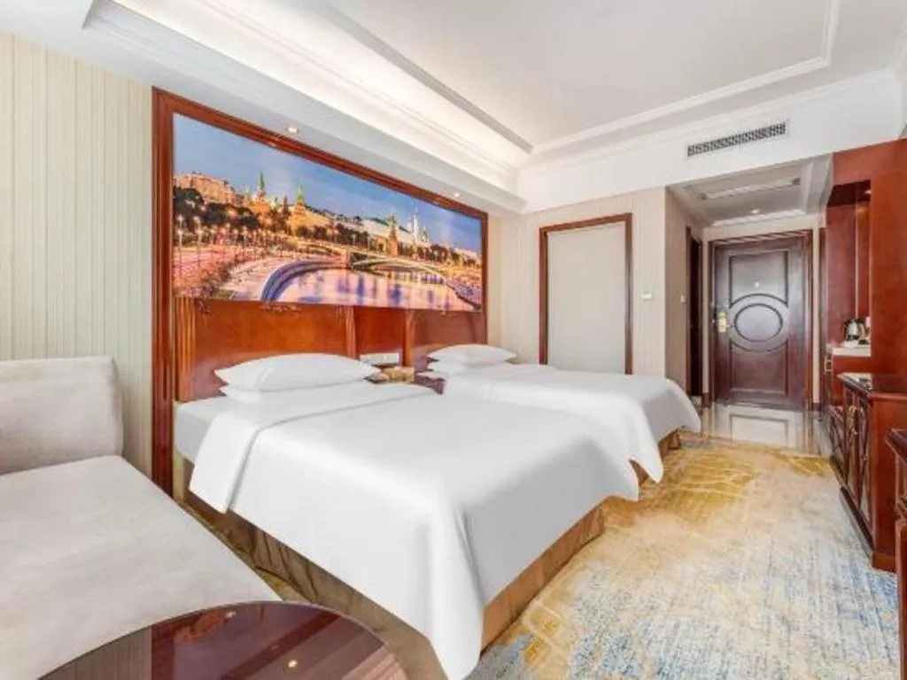 Bed in Vienna International Hotel Guangzhou Tianhe Olympic Stadium Dongpu