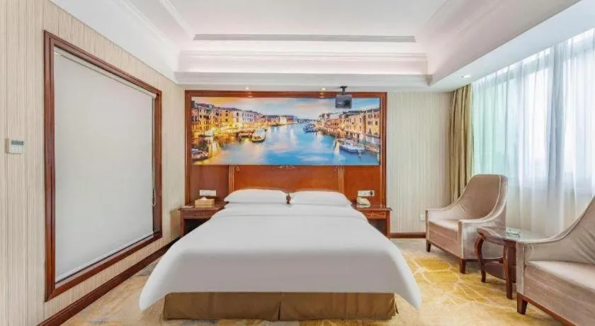 Bed in Vienna International Hotel Guangzhou Tianhe Olympic Stadium Dongpu