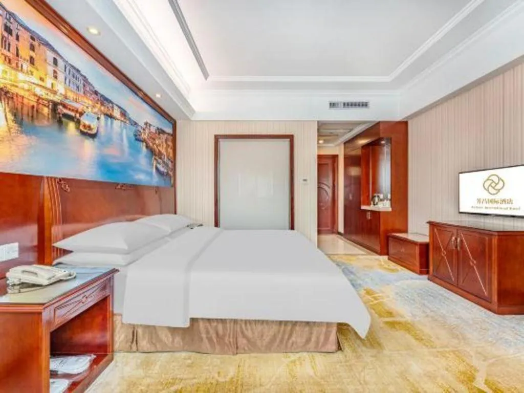 Bed in Vienna International Hotel Guangzhou Tianhe Olympic Stadium Dongpu