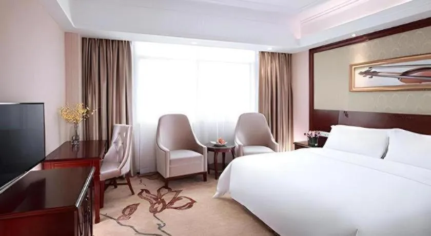 Bed in Vienna International Hotel Guangzhou Tianhe Olympic Stadium Dongpu
