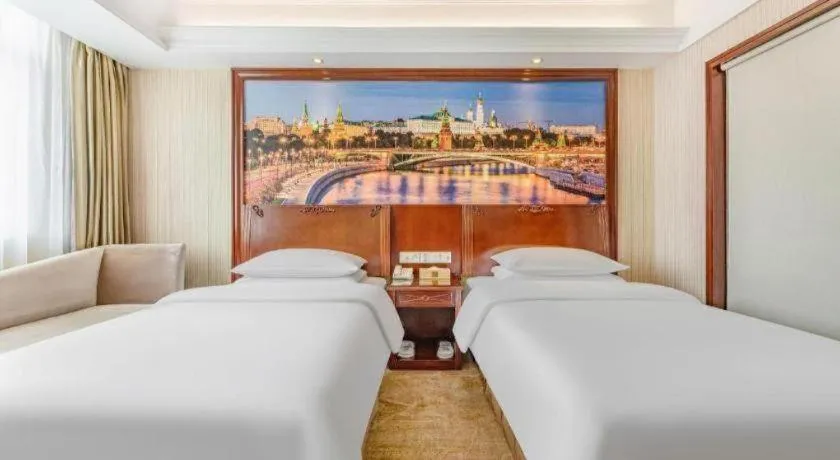 Bed in Vienna International Hotel Guangzhou Tianhe Olympic Stadium Dongpu