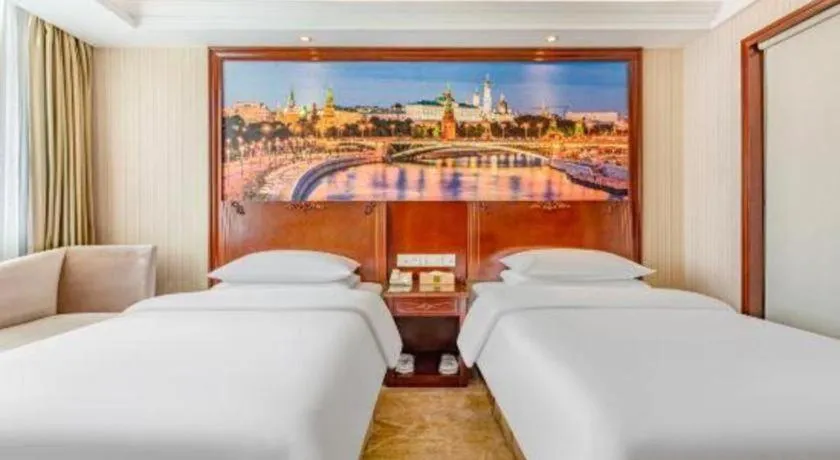 Bed in Vienna International Hotel Guangzhou Tianhe Olympic Stadium Dongpu