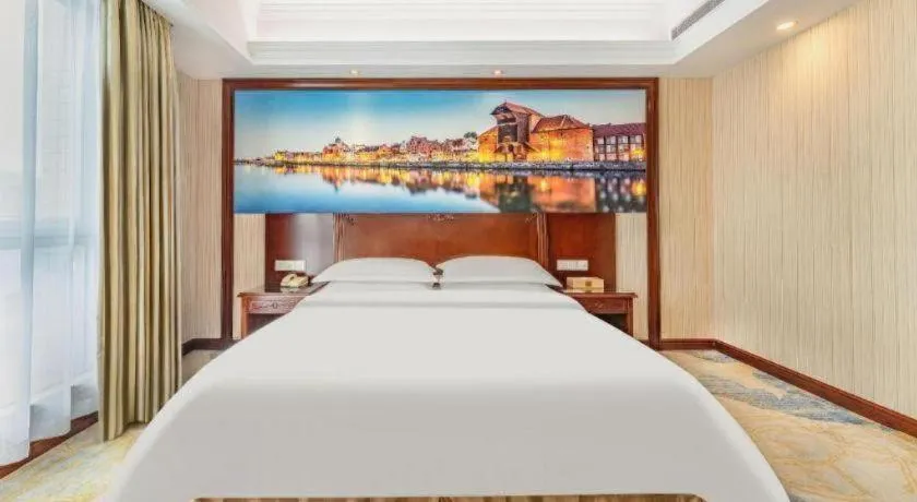 Bed in Vienna International Hotel Guangzhou Tianhe Olympic Stadium Dongpu