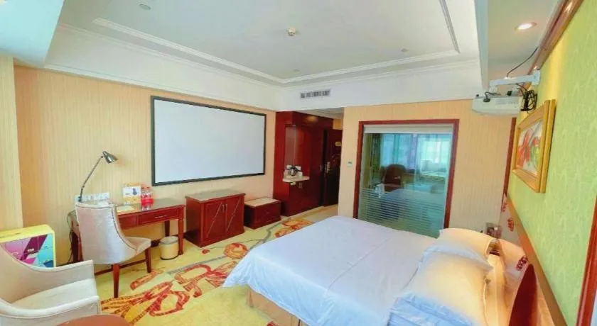 Bed in Vienna International Hotel Guangzhou Tianhe Olympic Stadium Dongpu