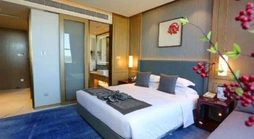 Bed in Bliss International Hotel Weihai