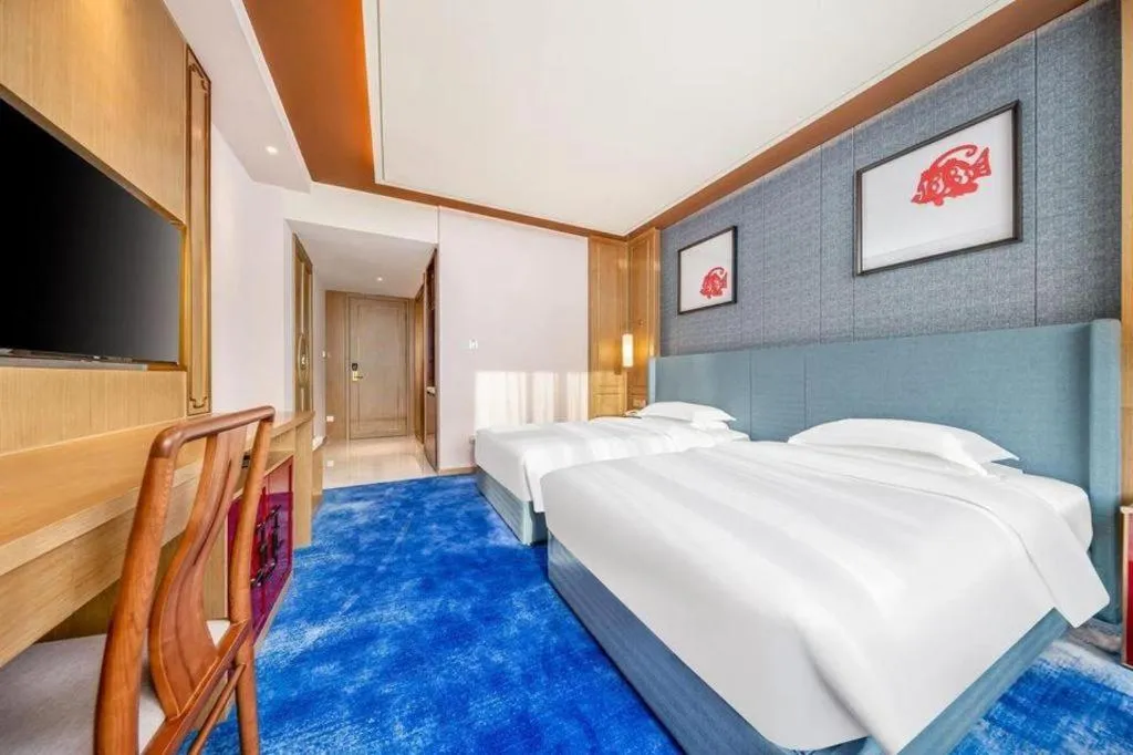 Bed in Bliss International Hotel Weihai