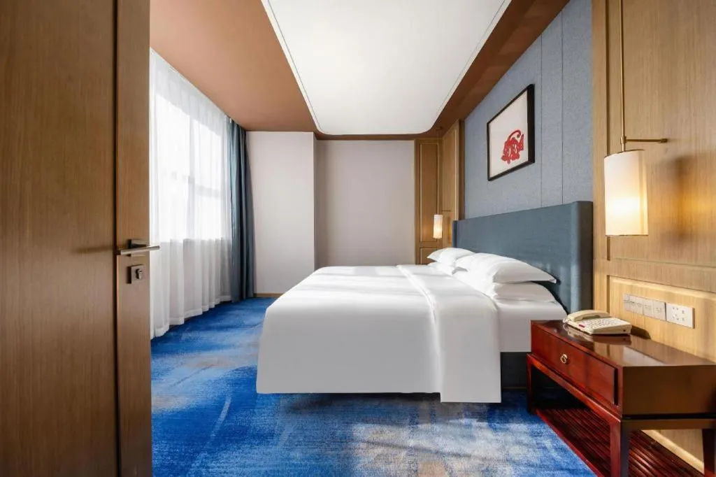 Bed in Bliss International Hotel Weihai