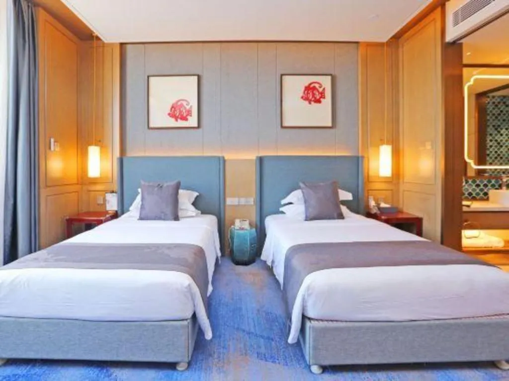 Bed in Bliss International Hotel Weihai