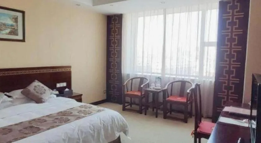 Bed in Bliss International Hotel Weihai