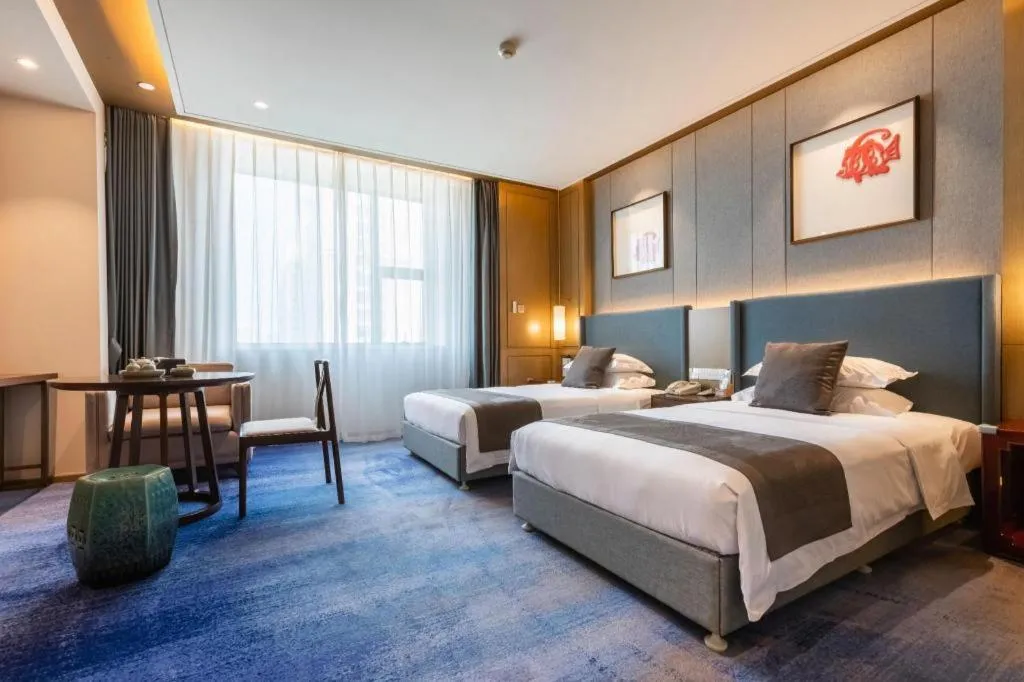 Bed in Bliss International Hotel Weihai