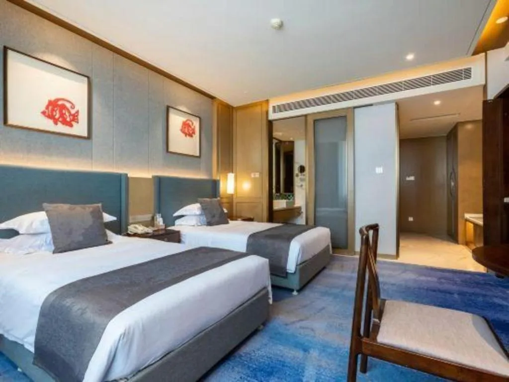 Bed in Bliss International Hotel Weihai