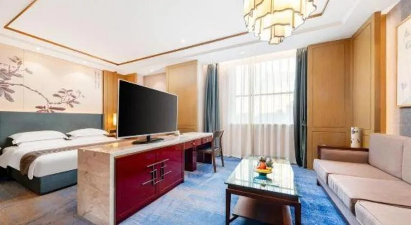 Bed in Bliss International Hotel Weihai