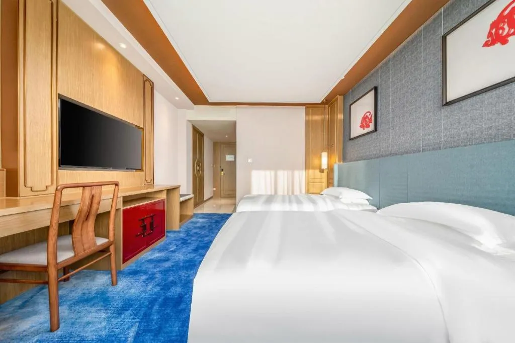 Bed in Bliss International Hotel Weihai
