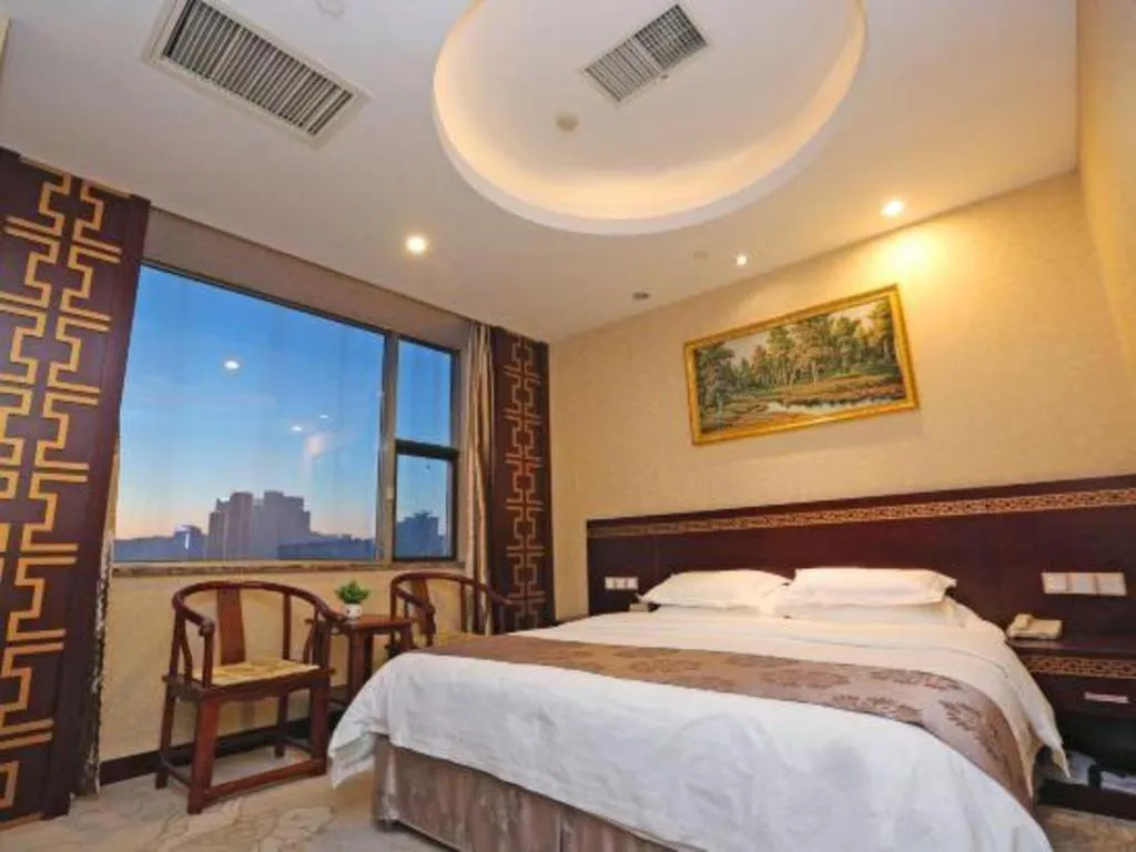 Bed in Bliss International Hotel Weihai