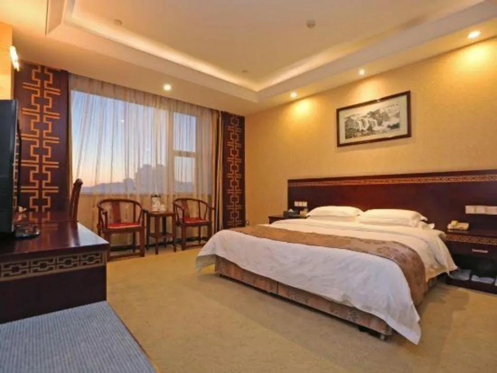 Bed in Bliss International Hotel Weihai