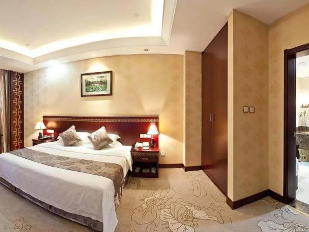 Bed in Bliss International Hotel Weihai