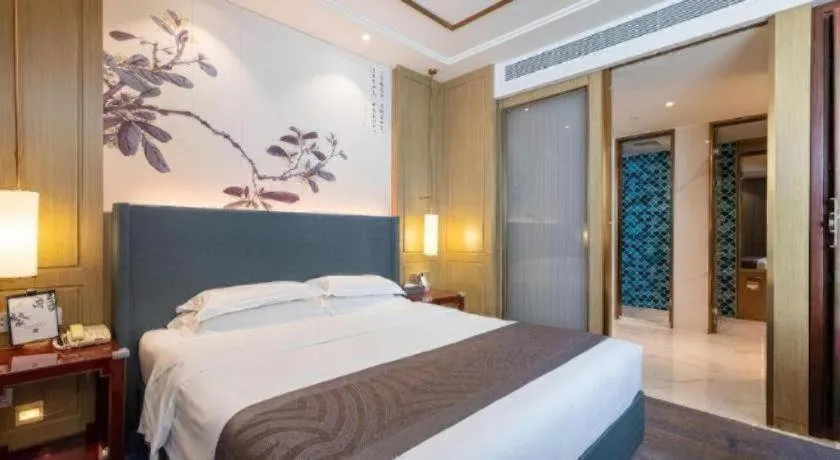 Bed in Bliss International Hotel Weihai