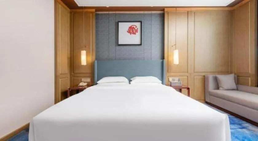 Bed in Bliss International Hotel Weihai