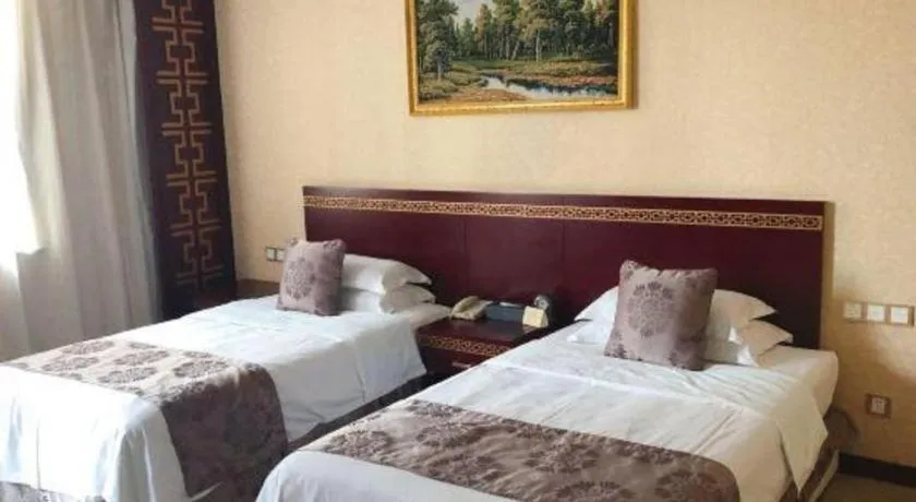 Bed in Bliss International Hotel Weihai