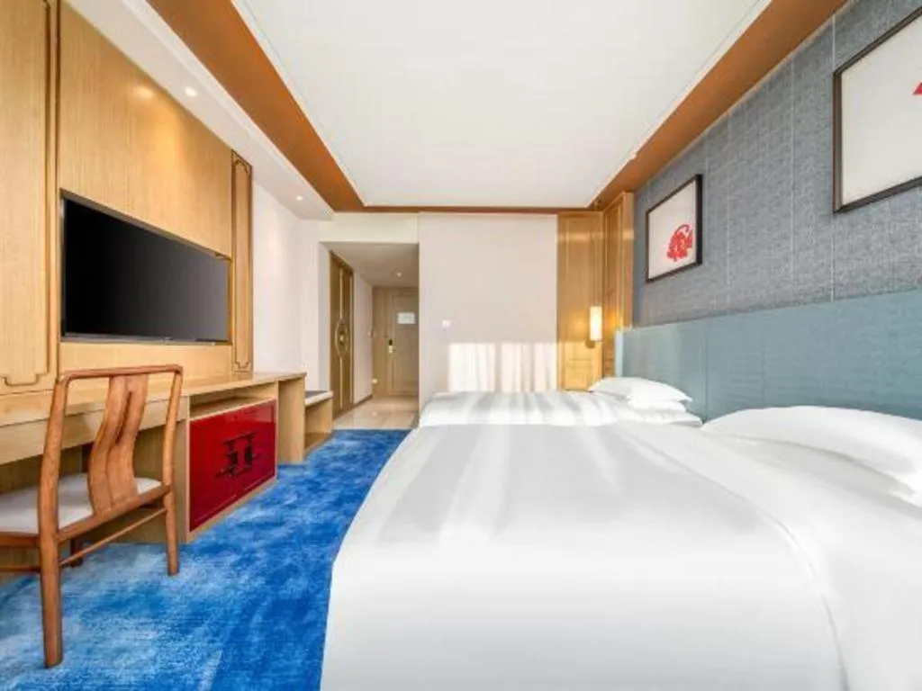 Bed in Bliss International Hotel Weihai